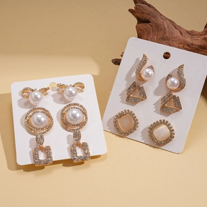 12-piece vintage gold earring set with faux pearls, rhinestones, and geometric cat-eye stones