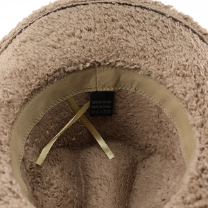 Detail view of brown faux rabbit fur hat interior with yellow adjustable drawstring