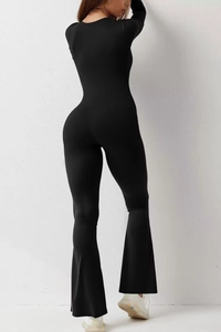 Rear view of black long sleeve jumpsuit showing waist contouring and flared leg fit