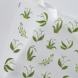 3D embossed lily of the valley nail stickers with detailed green floral texture