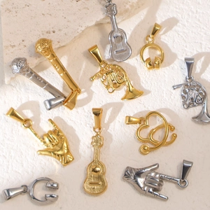 Retro stainless steel music pendants featuring microphone, guitar and headphones styles