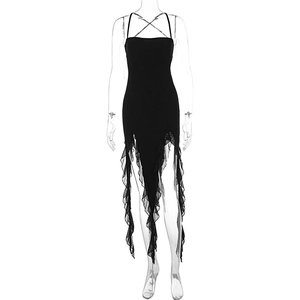 Close-up of black halter dress with mesh ruffles and irregular hemline details