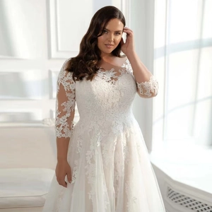 Elegant plus size white lace wedding dress with floral embroidery and mesh trail