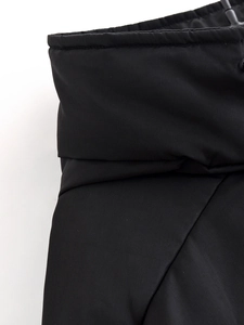 Detailed close-up showing fine stitching and dense texture on black techwear parka fabric