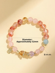 Detail of beaded bracelet with quartz gems, golden DaJi tag and 52mm inner diameter