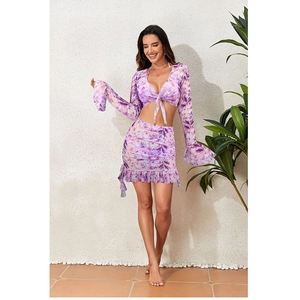Two-piece purple floral bikini set with flared long sleeves and ruffled mini skirt