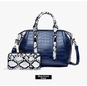Detail view of navy faux crocodile and snakeskin print tote bag set with matching wallet