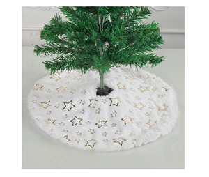 Detail of white faux fur Christmas tree skirt with gold sequin stars and soft plush texture