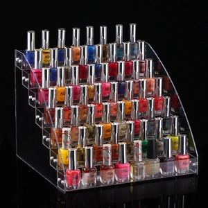 Clear acrylic tiered nail polish display rack featuring multi-layer storage on black background