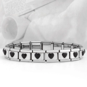 Detail of 9mm modular stainless steel bracelet link with black heart gemstone inlay