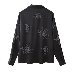 Back view of black satin long sleeve shirt with white beaded floral embroidery details