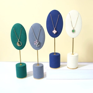 Elegant velvet jewelry display stands with gold metal poles in four sophisticated colors