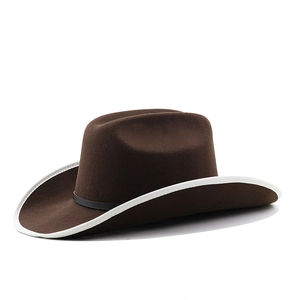 Detailed side view of a brown felt cowboy hat with white edge and black leather band