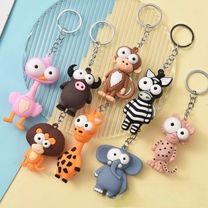 Detailed group view of colorful 3D cartoon animal keychains with silver metal rings