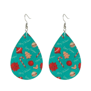 Detail of Christmas teardrop leather earrings in turquoise with Merry Christmas print