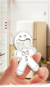 Detailed view of silver gingerbread man bottle opener magnet in modern kitchen setting