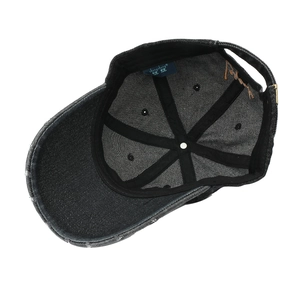 Black distressed denim baseball cap with orange embroidery and adjustable metal buckle