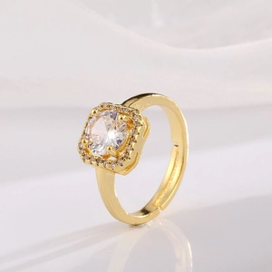 Adjustable gold plated copper ring with a large round cubic zirconia halo setting