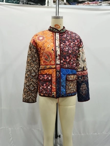 Detailed patchwork quilted jacket with paisley patterns and floral ethnic prints