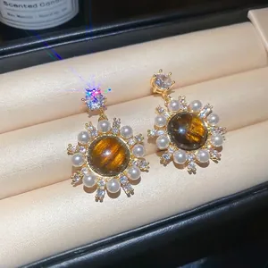 Vintage sunflower drop earrings with tiger eye stone, pearls and zircon in a jewelry box