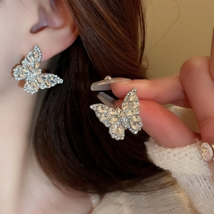 Elegant butterfly stud earrings with sparkling rhinestones in a silver-tone finish