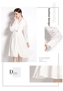 Détails de robe blanche avec broderie dentelle, manches lanterne et ceinture à cœur