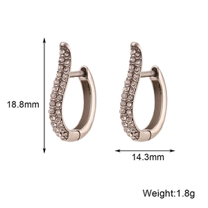 Symmetric silver U-shaped hoop earrings with sparkling cubic zirconia on white background