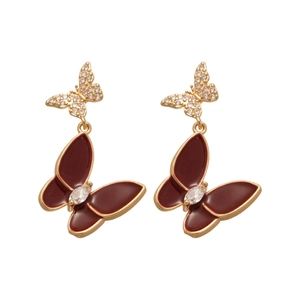 Elegant gold-tone butterfly drop earrings with red enamel and sparkling zircon stones