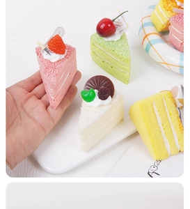 Macro shot of artificial multi-layer fruit mousse cake slices for photography props