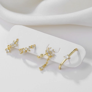 Elegant 18k gold plated flower and butterfly zircon earring set with ear cuffs on white silk