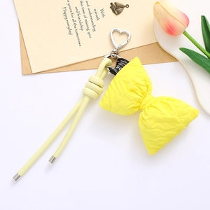 Chic yellow PU leather bowknot keychain with heart metal clasp and matching lanyard