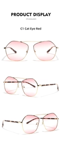 Detail of rose gold cat eye sunglasses with gradient pink lenses and tortoiseshell temples