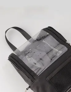 Waterproof black cosmetic bag featuring a clear PVC front cover and durable mesh side pocket