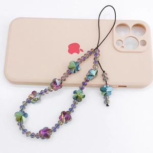 Iridescent crystal bead phone charm with flower beads on a pink smartphone case
