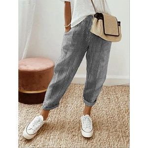 Detail of grey striped woven harem pants featuring elastic waist and breathable fabric