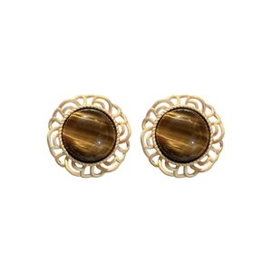 Retro hollow gold frame earrings with round brown tiger eye stone on white background