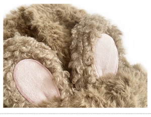 Detailed close-up of fluffy rabbit ears and soft faux fur texture on a knit beanie