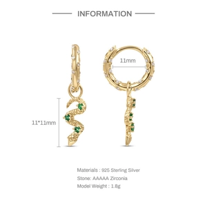 Macro detail of gold-plated S925 silver snake hoop earrings with green zirconia stones