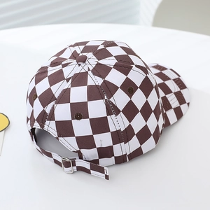 Brown and white checkerboard baseball cap with adjustable silver metal buckle back