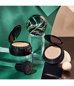 Detailed macro view of Olauty moisture cushion foundation with black case and mushroom puff