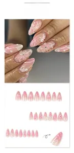 Detailed 3D flower and pearl nail art on pink gradient almond-shaped press-on nails