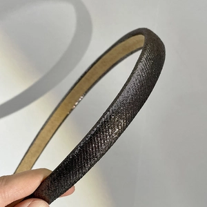 Sparkling dark grey narrow headband with glitter fabric and beige inner lining