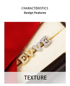 Detailed macro view of gold and silver initial pendants with zircon micro-paving texture