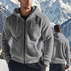Outdoor shot of men's gray thick fleece hoodie with zipper and drawstring in snowy mountains