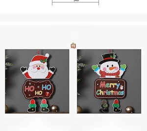 Detailed view of Santa and Snowman paper hanging ornaments with swinging boots legs