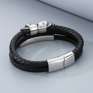 Men's multilayer black braided leather bracelet with silver skull charms and magnetic clasp