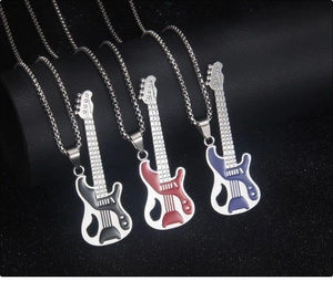 Detailed view of guitar necklaces in black, red, and blue enamel on leather surface