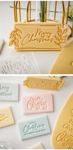 Detail of Christmas cookie stamp embossers with Merry Christmas greetings for baking