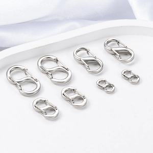 Detailed view of silver stainless steel S-shape spring clasps in various sizes for DIY jewelry