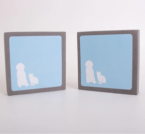 Detail view of gray and blue square pet hair removal sponges with cute cat and dog silhouettes